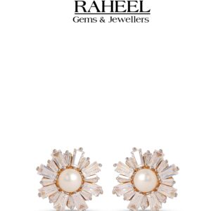 Close-up image of elegant pearl and Zircon stud earrings from Raheel Gems & Jewellers, featuring a central pearl surrounded by sparkling Zircon accents, set in a gold-tone metal. The earrings are displayed against a clean white background, highlighting their intricate design and shine.
