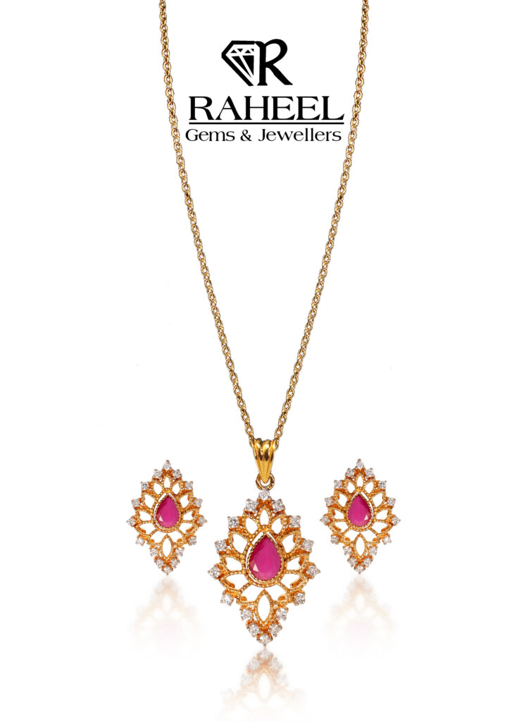 A high-quality gold necklace and earring set featuring a pink stone centerpiece with intricate halo detailing, ideal for formal occasions and adding timeless beauty.