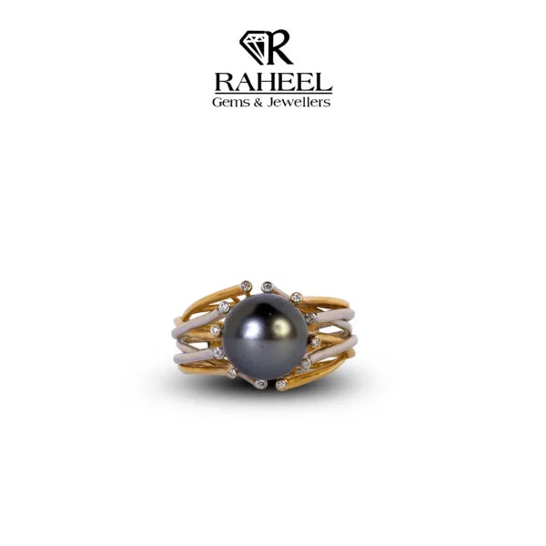 An exquisite ring by Raheel Gems & Jewellers in Clifton showcasing a central black pearl encased in a delicate gold and silver setting adorned with small diamonds.