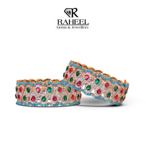 Handcrafted 21kt gold Nauratan bridal cuff bangles featuring real ruby, emerald, and turquoise by Raheel Gems & Jewellers Karachi.