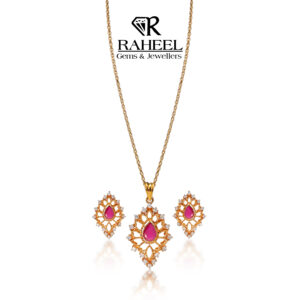 Royal Ruby Filigree Pendant Set with pear-cut ruby and zircon accents by Raheel Gems & Jewellers Karachi.